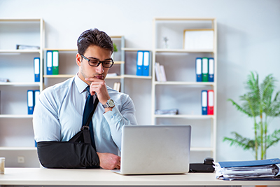 Office Worker With Arm In Sling